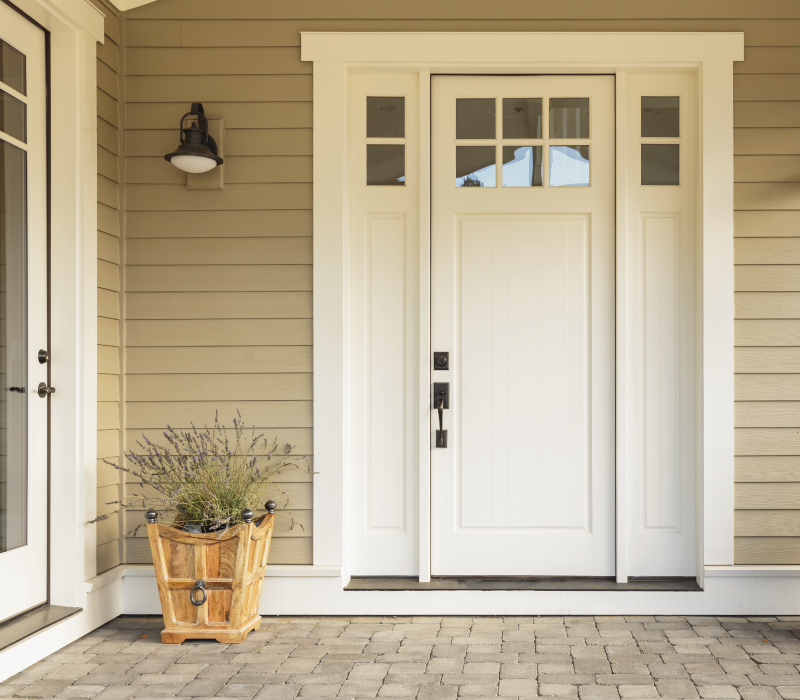 Home Exterior with Beige Siding and White Doors