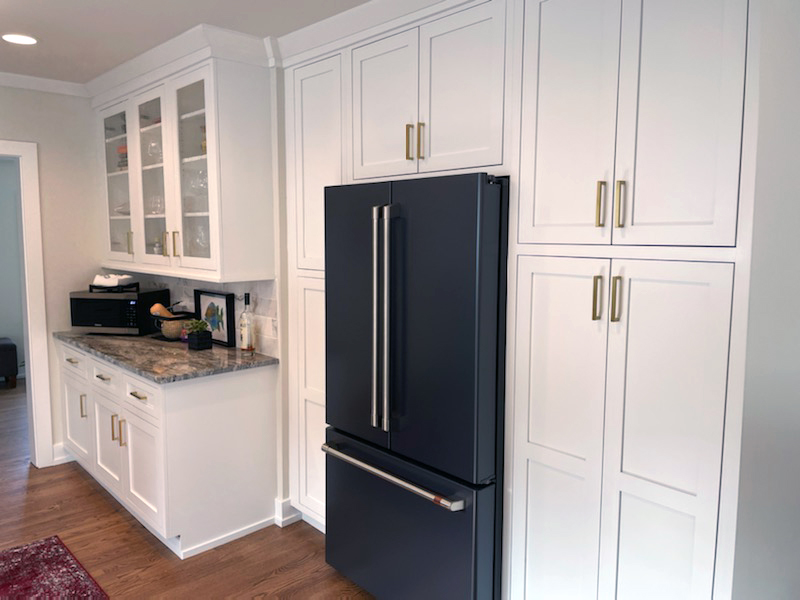 White Contemporary Kitchen Cabinets with Gold Pulls