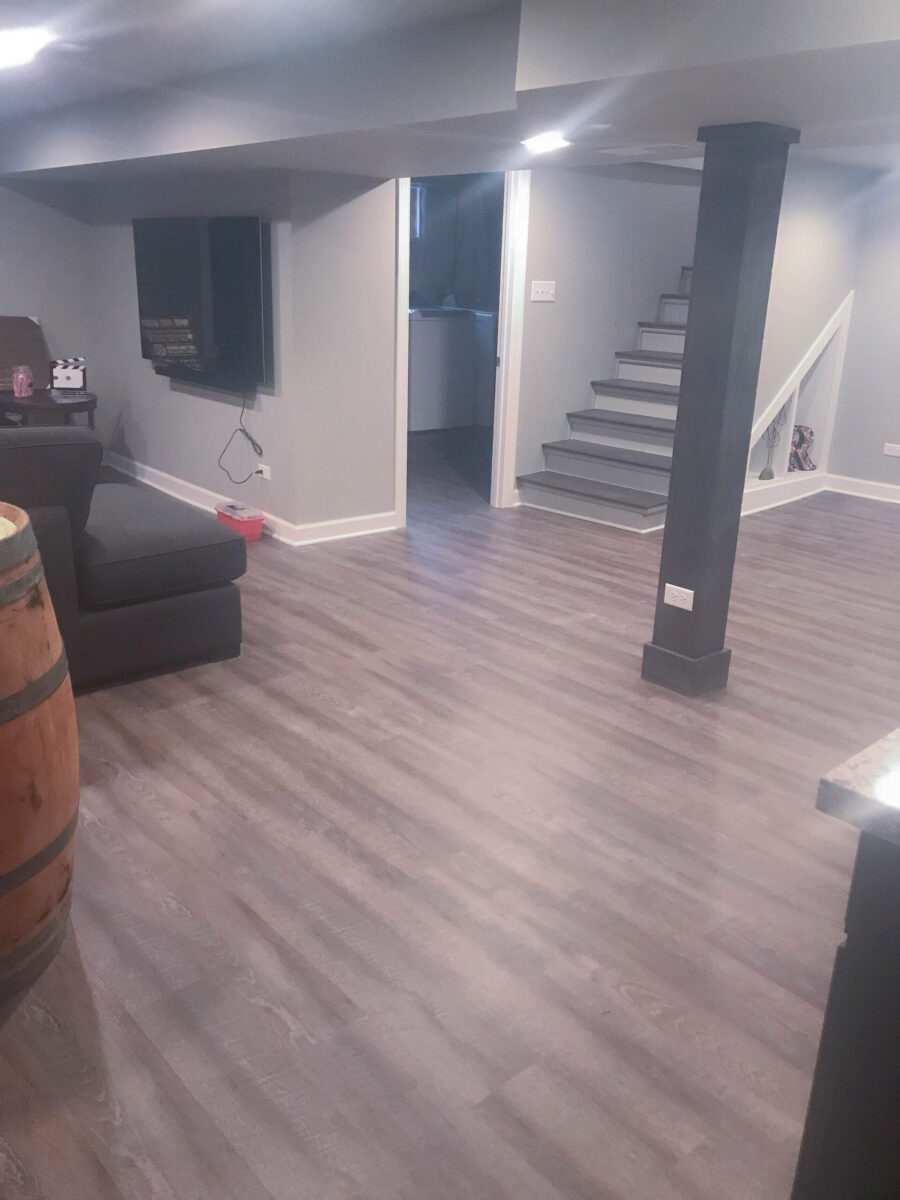 Basement Living Room and Stairs with Built-in Shelf