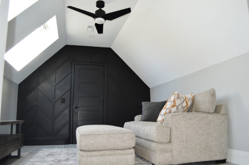 White and Gray Lounge Area with Black Accent Wall