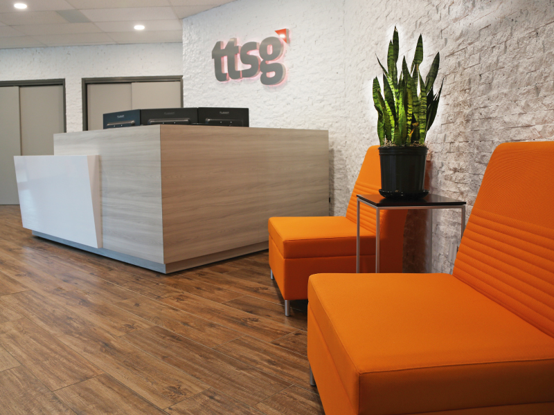 Commercial Office Space Reception Area with Stone Wall and Wooden Floors