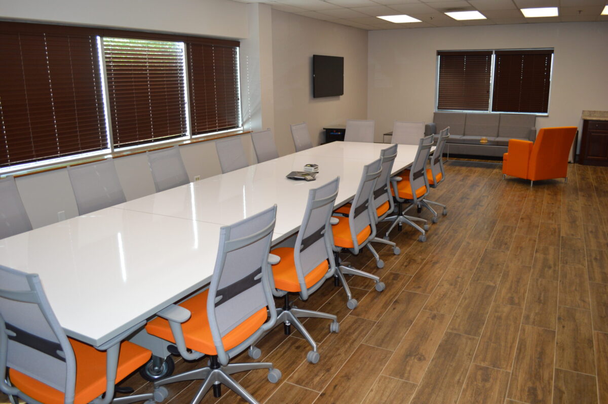 Commercial Conference Room with Wooden Floors and Stone Walls