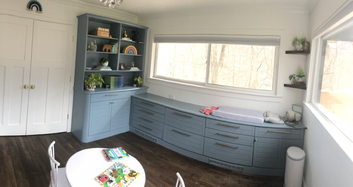 Children's Nursery with Blue Built-in Cabinets and Farmhouse Interior Finishes