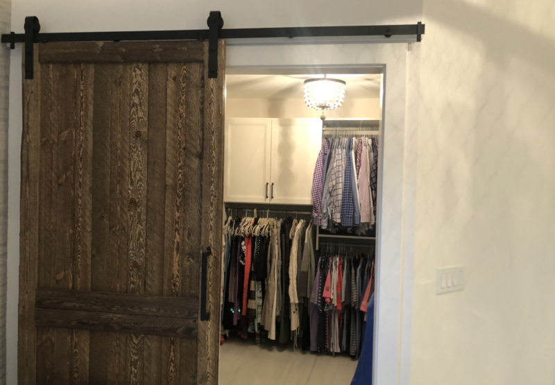Closet with Barn Wood Door and Rustic Interior Finishes
